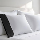 Pillow case with Black color cuff displayed on a bed with white bedding