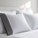 Pillow case with Gray color cuff displayed on a bed with white bedding