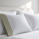 Pillow case with Linen color cuff displayed on a bed with white bedding